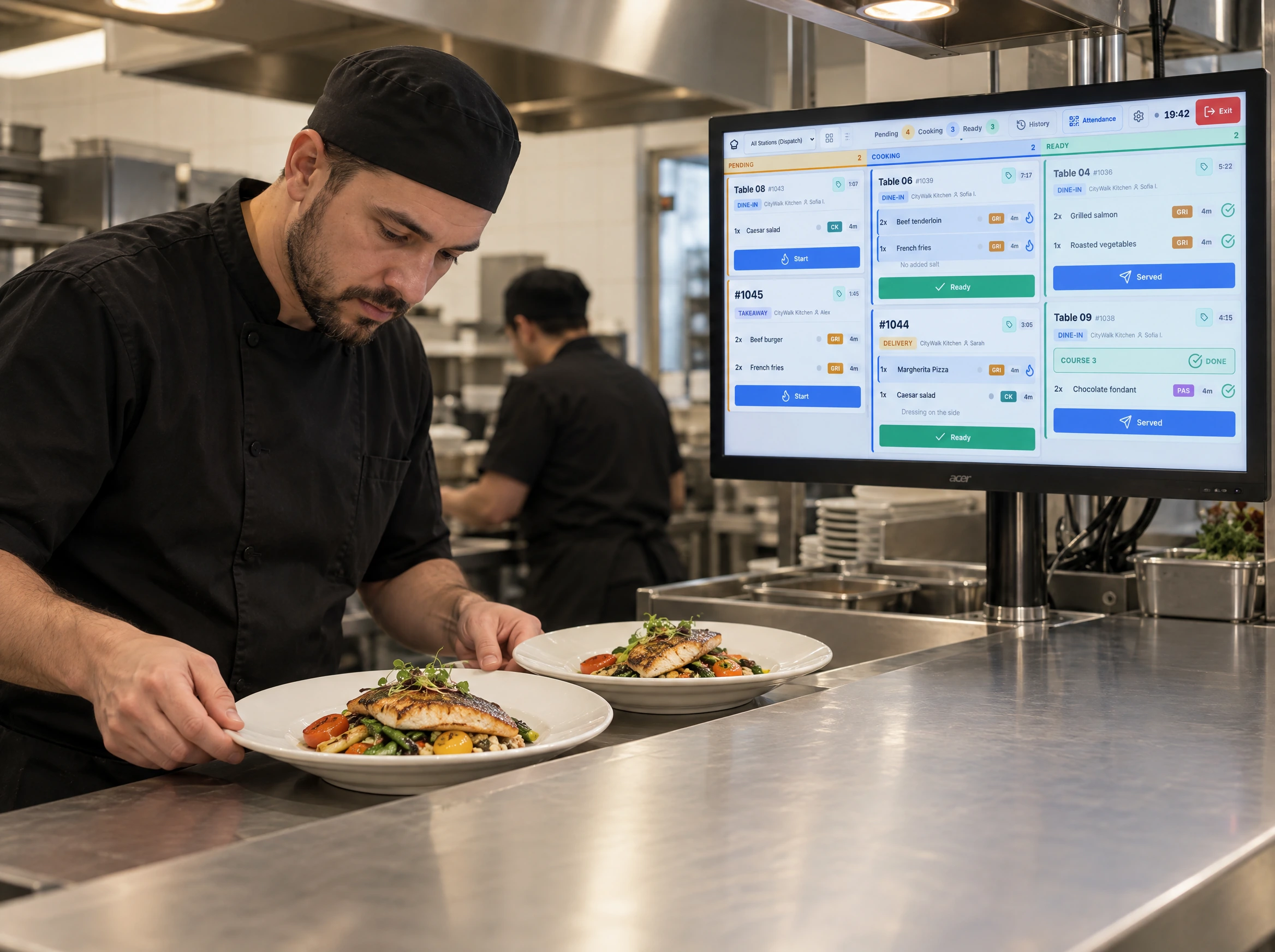 Chef checking freshly prepared dishes beside a kitchen display at the pass